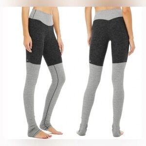 Alo Yoga High-Waisted Goddess Ribbed Leggings in gray and black.